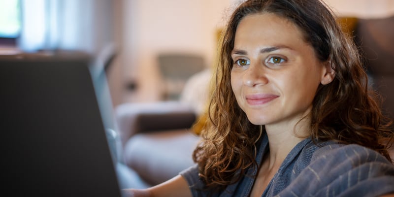 A lady looking at her iPad buying a contraception online