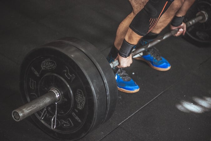 a man in the gym lifting dead weight