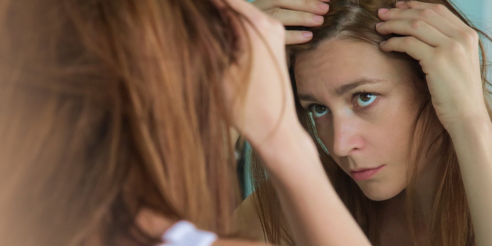 women checking for hair loss